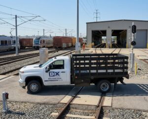Firefly_Gemini Flash_Place this delivery truck at a rail transit maintenance facility- passenger and freig 772194 (1)